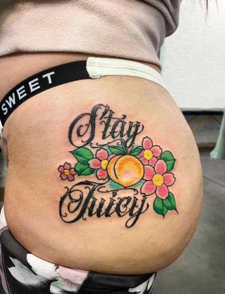 Colorful Flowers and Script Butt Tattoo