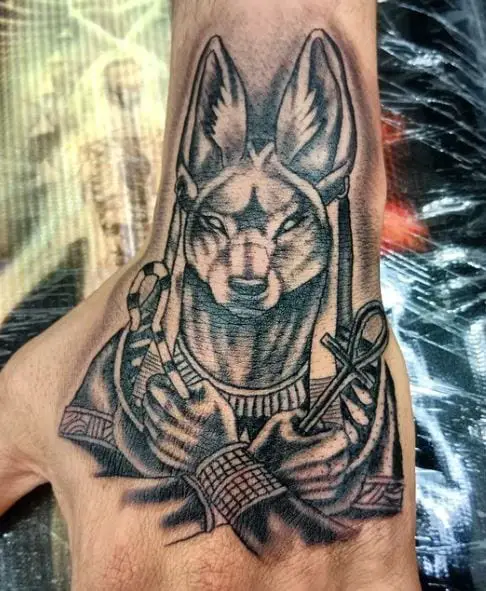 Black and Grey Anubis Hand Tattoo