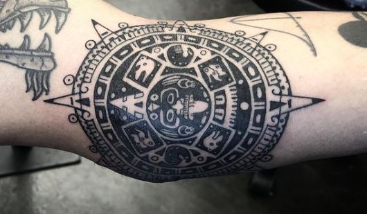 Mayan Sun Symbol Elbow Tattoo