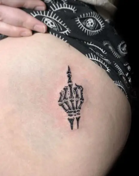 Black Skeleton Hand Butt Tattoo