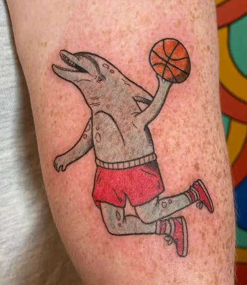 Colored Dolphin Playing Basketball Biceps Tattoo
