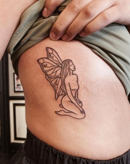 Black Sitting Fairy Ribs Tattoo