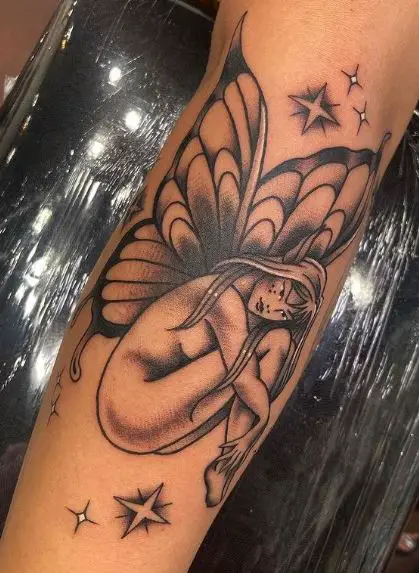 Black and Grey Shaded Sitting Fairy Forearm Tattoo