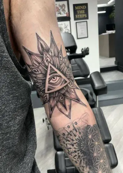 Mandala Ornament and Eye of Providence Biceps Tattoo