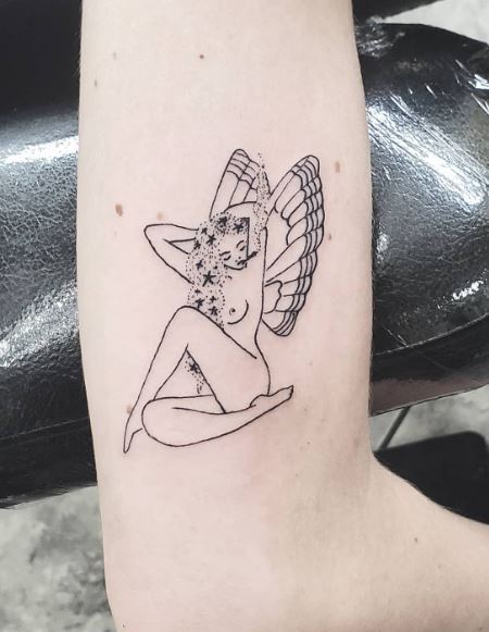 Sitting Fairy with Stars in Hair Arm Tattoo