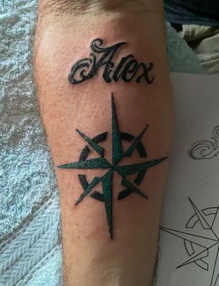 Black and Green Nautical Star with Lettering Forearm Tattoo