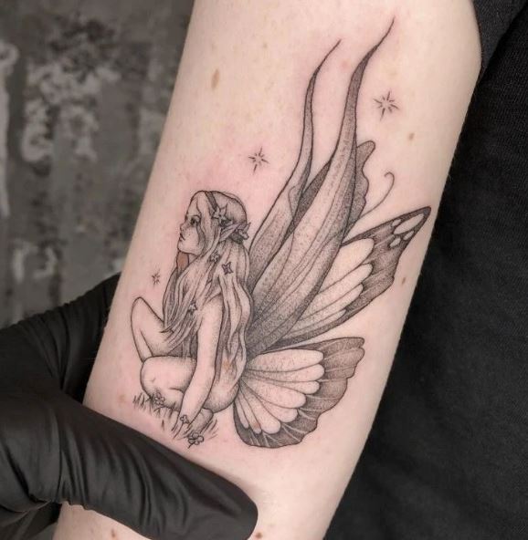 Stars and Sitting Fairy Biceps Tattoo