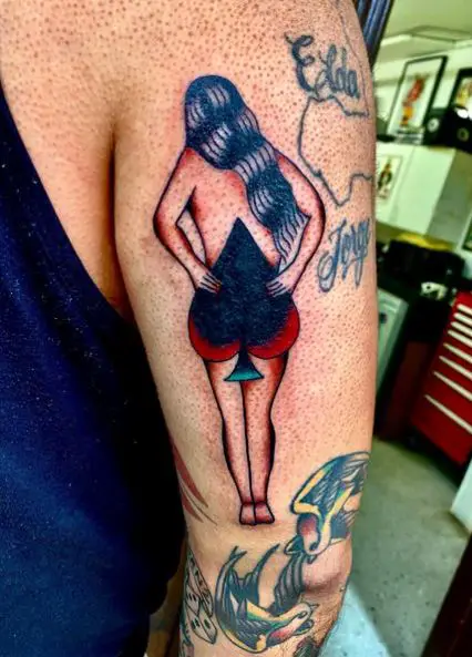 Colored Woman and Spade Arm Tattoo