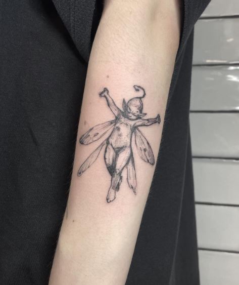 Black Sketched Fairy Biceps Tattoo