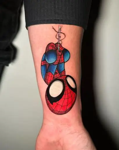 Small Upside Down Baby Spiderman Wrist Tattoo