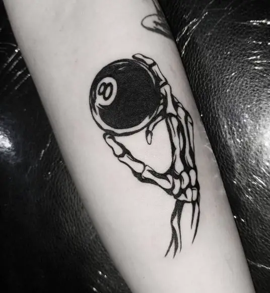 Black and White Skeleton Hand and 8 Ball Forearm Tattoo
