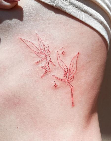 Red Stars and Dancing Fairies Ribs Tattoo