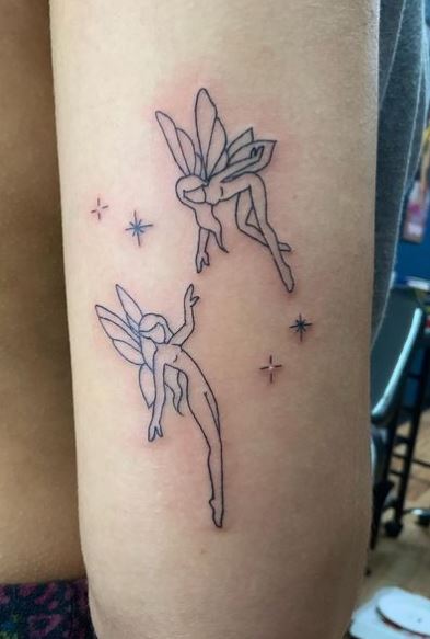 Stars and Two Fairies Arm Tattoo