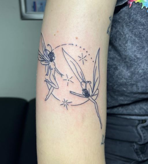 Stars and Two Dancing Fairies Arm Tattoo