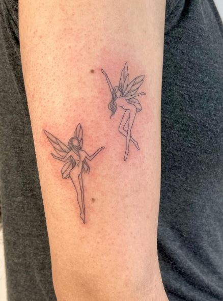 Two Dancing Fairies Arm Tattoo