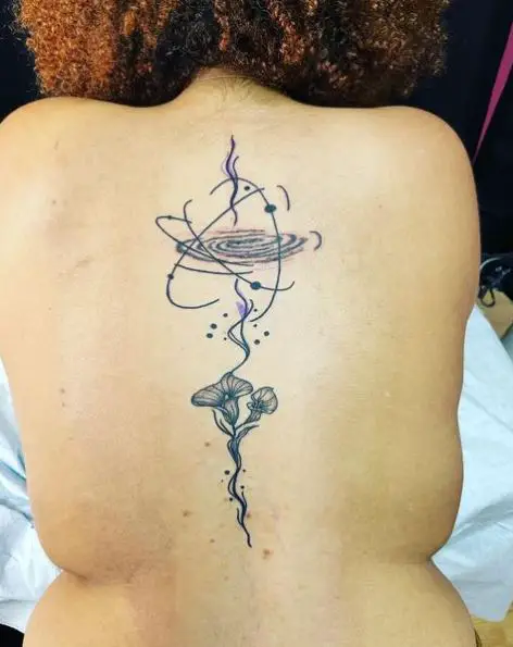 Black Hole and Calla Lily Spine Tattoo