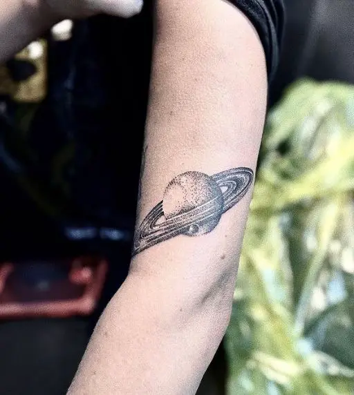 Black and Grey Saturn Arm Tattoo