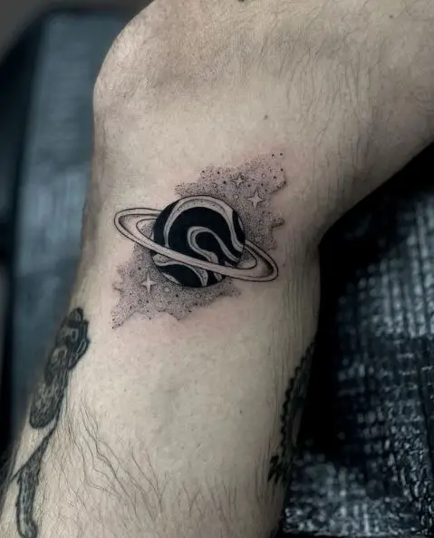 Black and Grey Saturn Tattoo