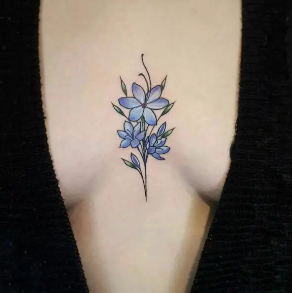 Blue Flowers Bunch Sternum Tattoo