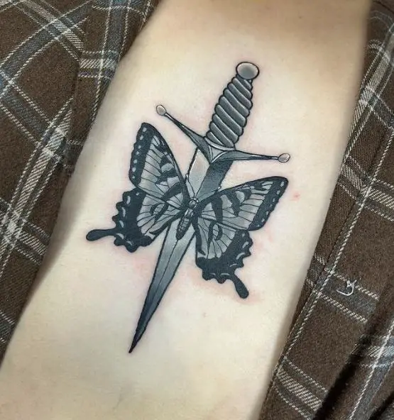 Butterfly and Dagger Tattoo on the Sternum