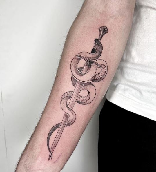 Coiled Snake and Dagger Forearm Tattoo