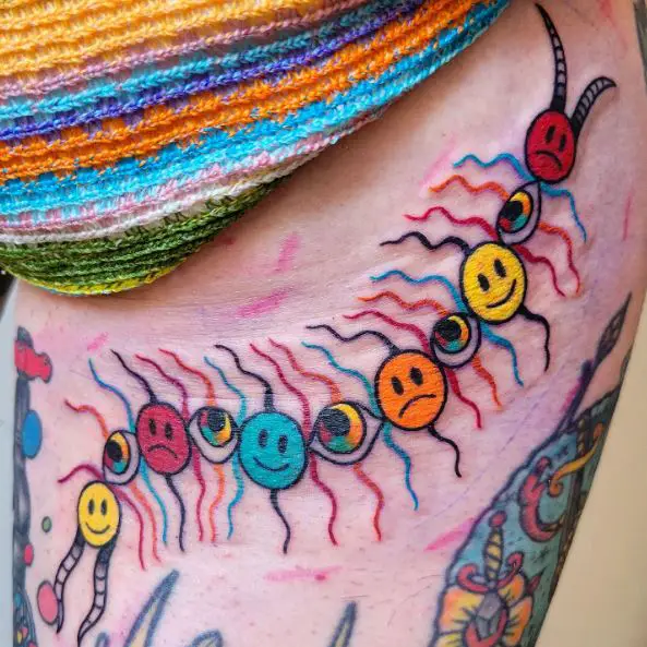 Colorful Eyes, Sad and Happy Faces Centipede Tattoo