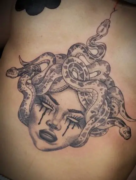 Crying Face Medusa Sternum Tattoo