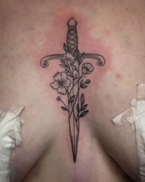 Flowers and Dagger Sternum Tattoo