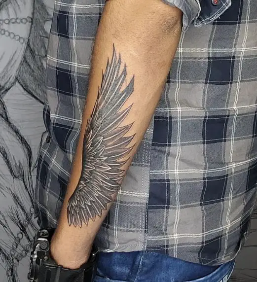 Grey Angel Wings Forearm Tattoo