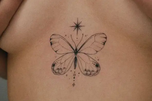 Greyscale Butterfly with Sparks Sternum Tattoo