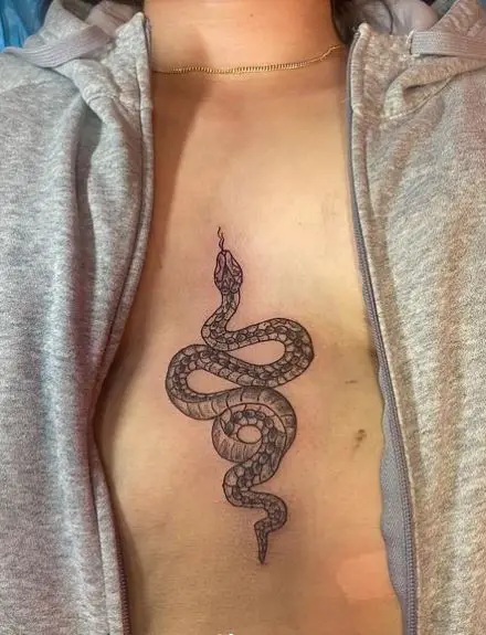 Greyscale Coiled Snake Sternum Tattoo