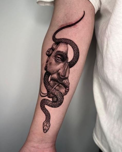 Greyscale Snake with Human Face Forearm Tattoo