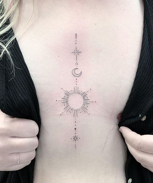 Moon with Sparks Sternum Tattoo