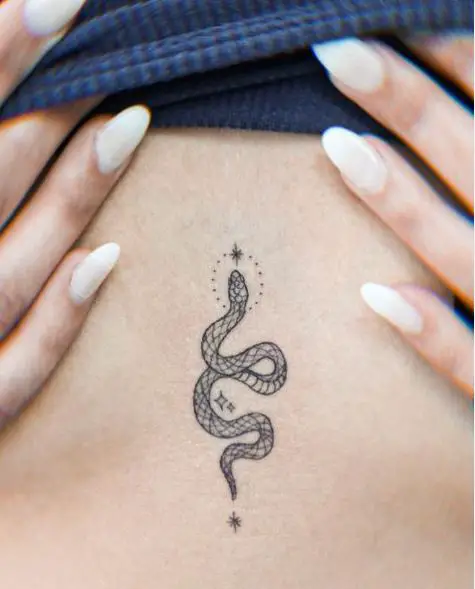 Patterned Small Snake with Sparks Sternum Tattoo