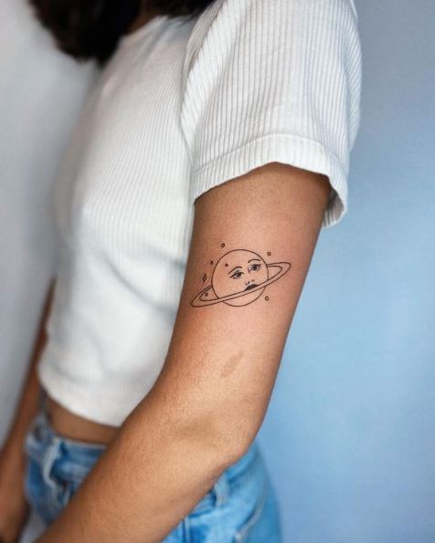 Saturn Face Arm Tattoo