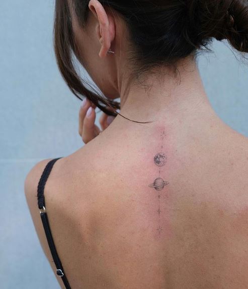 Simple Saturn and Earth Back Spine Tattoo