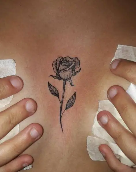 Small Single Rose Sternum Tattoo