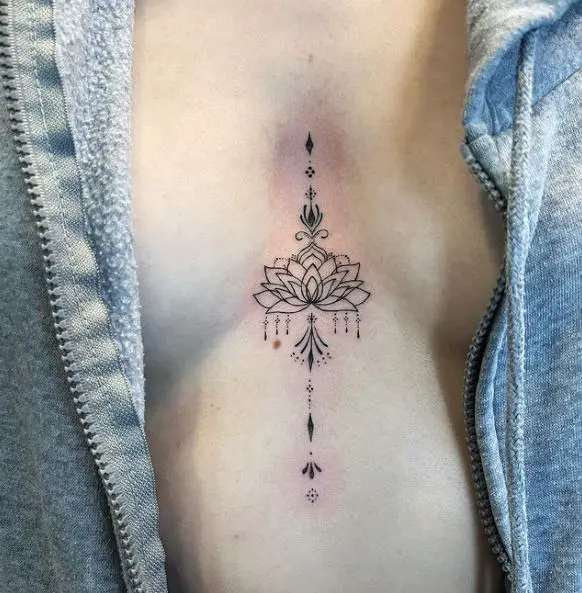 Small Unalome and Lotus Sternum Tattoo