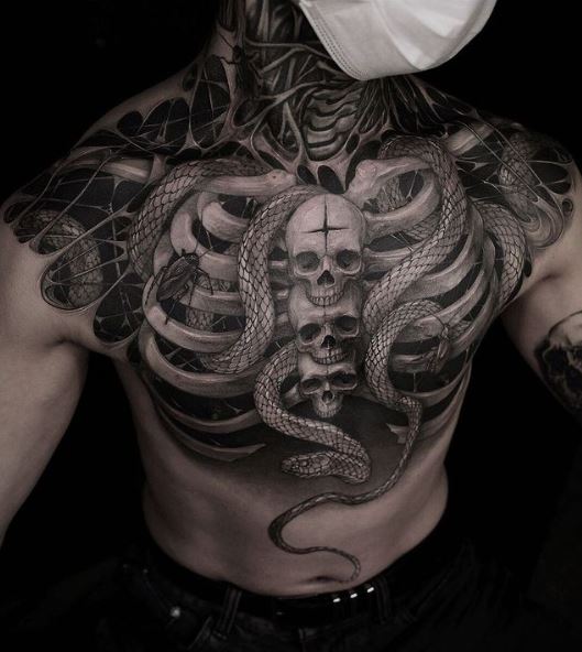 Snakes and Skull Chest Tattoo