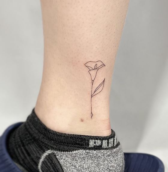 Tiny Black Line Leg Tattoo