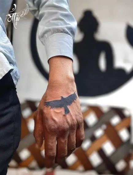 Tiny Bold Ink Bird Cover Up Tattoo