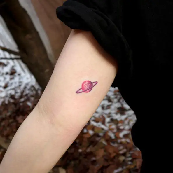 Tiny Pink Saturn Arm Tattoo
