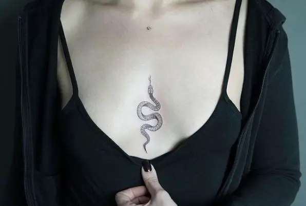 Tiny Snake Tattoo on Sternum