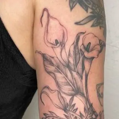 Fine line calla lily flower tattoo on the inner