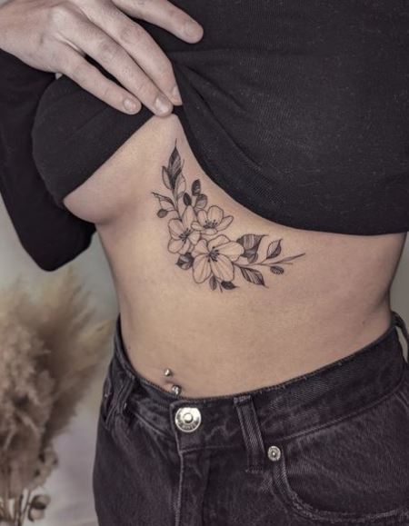 Black and Grey Lilies Under Boob Tattoo