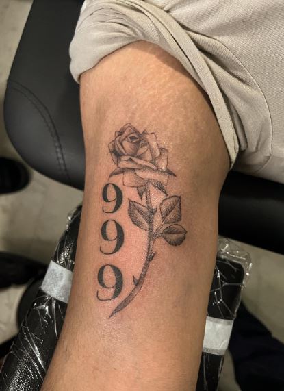 Grey Shaded Rose and 999 Biceps Tattoo