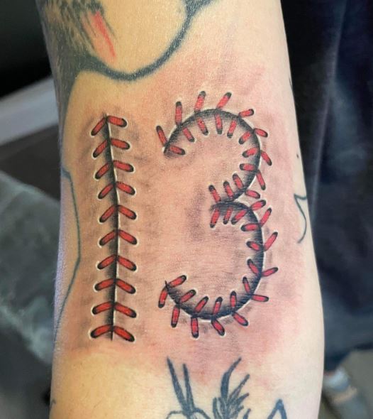 Baseball Seam Stitch as Number 13 Forearm Tattoo