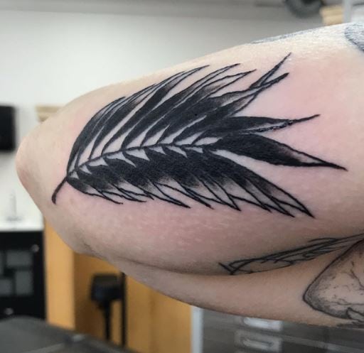 Black Shaded Palm Frond Arm Tattoo