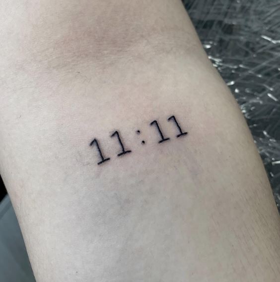 Black 11:11 Angel Number Forearm Tattoo