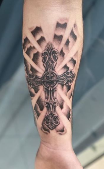 Clouds and Decorative Cross Forearm Tattoo